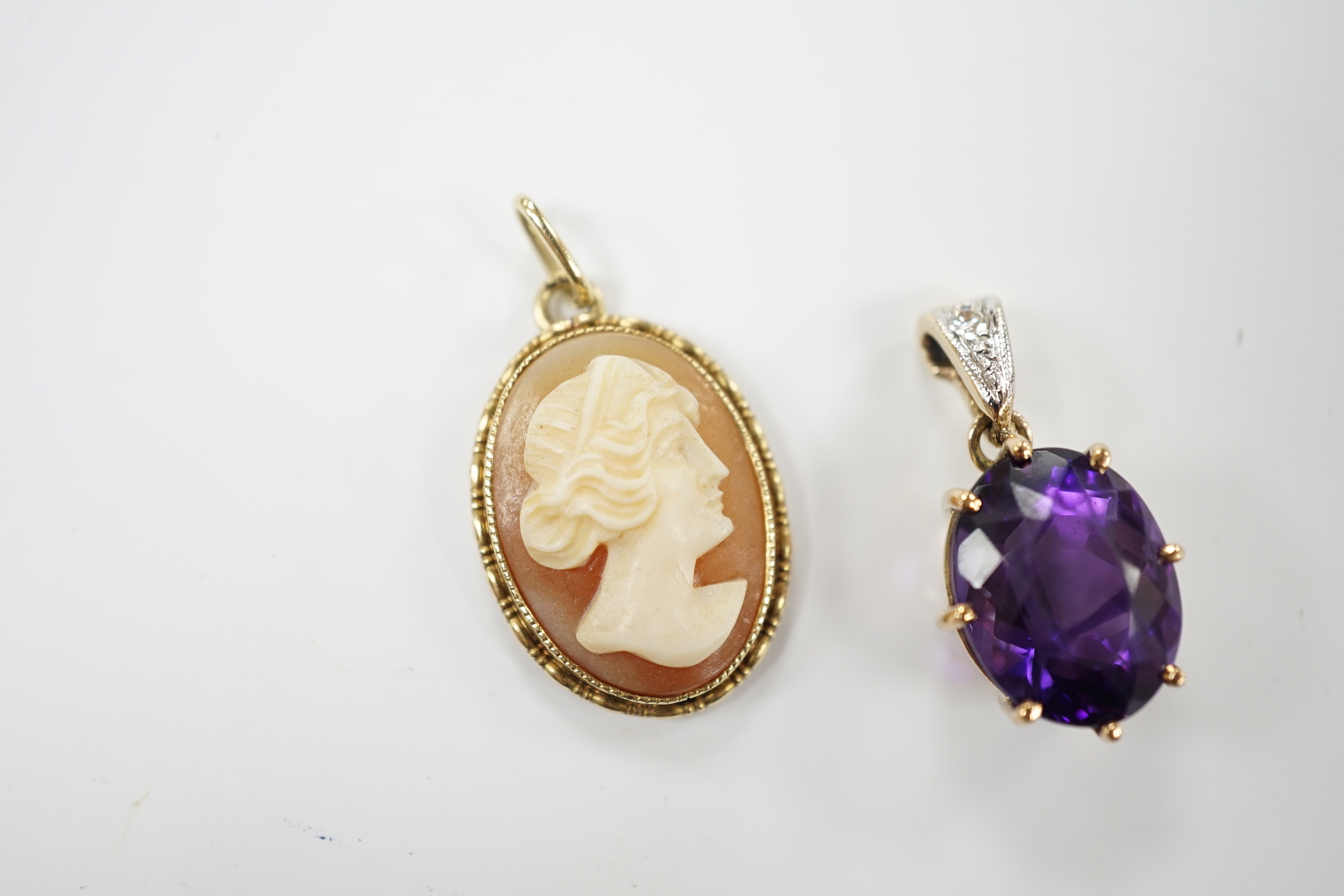 A yellow metal amethyst and diamond set pendant, 2cm, and a cameo pendant, stamped 585